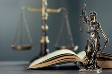 Legal and law concept statue of Lady Justice on the table with book and scale